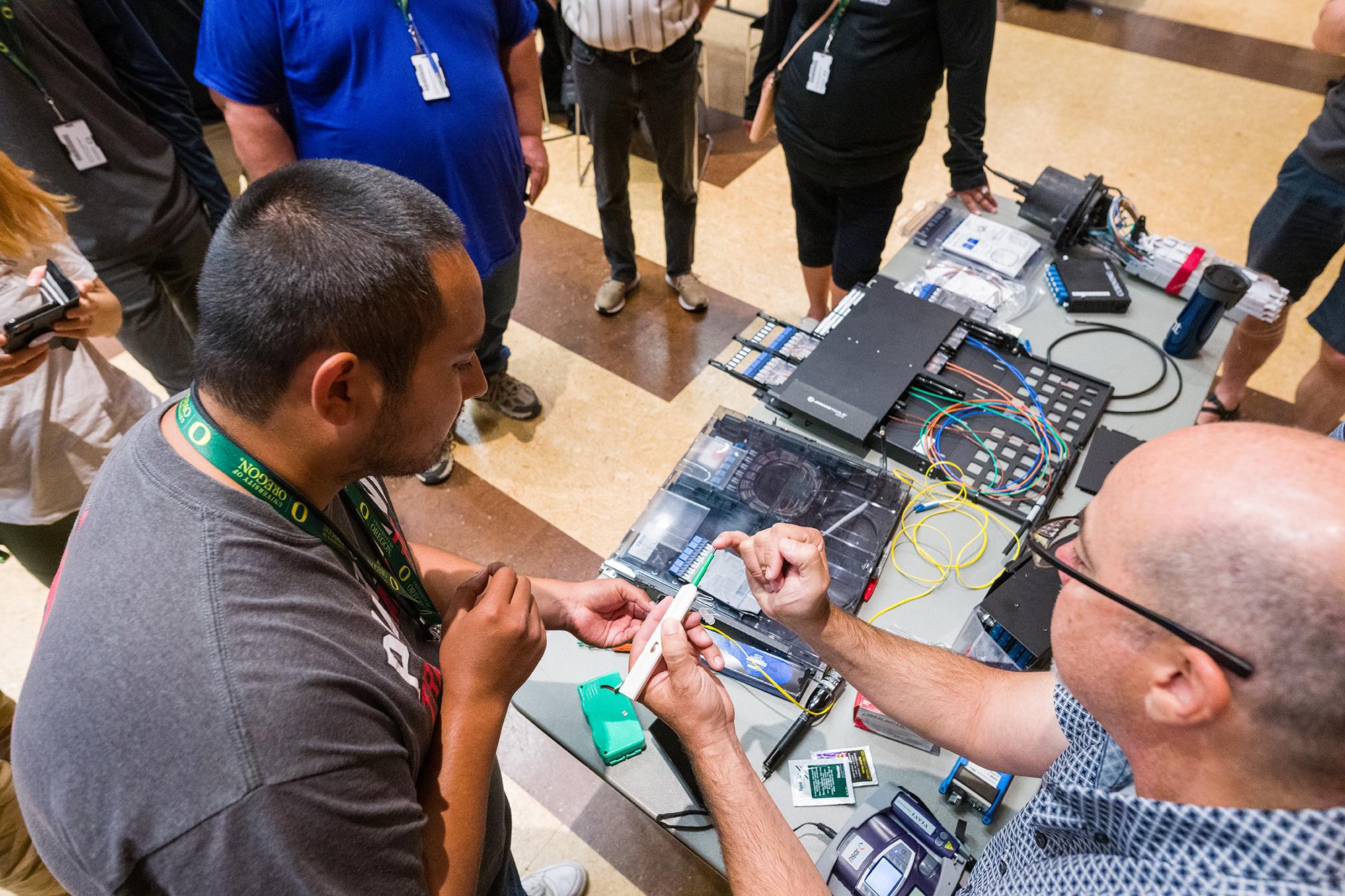 two men looking at electronics