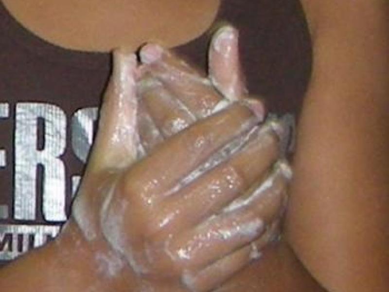 soapy hands being washed