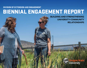 Division of Extension and Engagement Biennial Engagement Report Building and Strengthening University-Community Relationships - photo of two women talking in a field